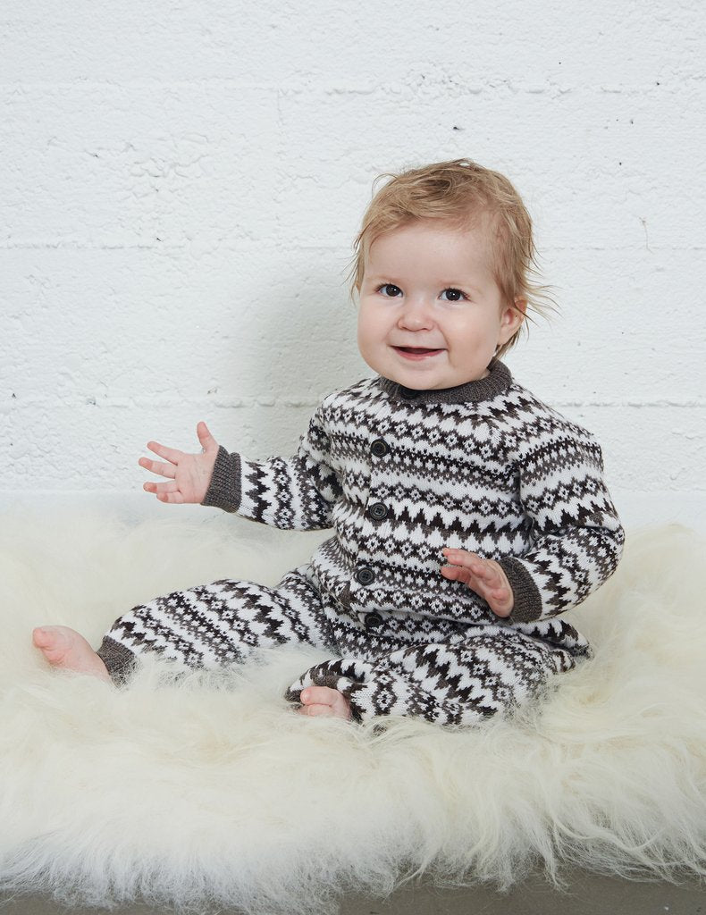 Warm and cozy baby jumpsuit, Icelandic design. Knitted of super soft 100% merino wool.